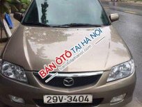 Mazda 323   MT 2004 - Bán xe cũ Mazda 323 MT đời 2004, màu nâu