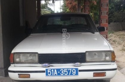 Nissan Tiida G 1986 -  Cần bán Nissan sản xuất 1986, màu trắng, nhập khẩu nguyên chiếc