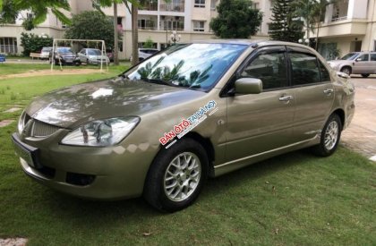 Mitsubishi Lancer Gala 2004 - Cần bán lại xe Mitsubishi Lancer Gala đời 2004, màu ghi vàng  