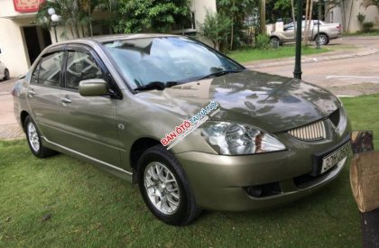 Mitsubishi Lancer Gala 2004 - Cần bán lại xe Mitsubishi Lancer Gala đời 2004, màu ghi vàng  