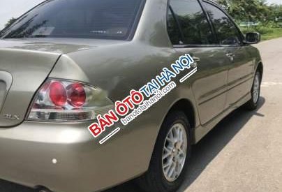 Mitsubishi Lancer 2004 - Cần bán xe Mitsubishi Lancer đời 2004, màu vàng 