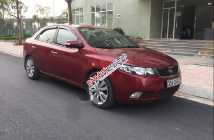 Kia Cerato    AT 2010 - Nhà tôi muốn bán chiếc xe Kia Cerato số tự động, màu đỏ, bản đầy đủ nhất