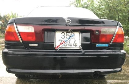 Mazda 323 1.6 MT 1998 - Bán xe Mazda 323 1.6 MT sản xuất năm 1998, màu đen, nhập khẩu 