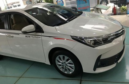 Toyota Corolla altis 1.8E CVT 2019 - Cần bán xe Toyota Corolla altis 1.8E CVT sản xuất 2019, màu trắng giá cạnh tranh