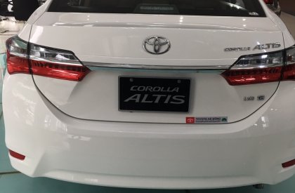Toyota Corolla altis 1.8E CVT 2019 - Cần bán xe Toyota Corolla altis 1.8E CVT sản xuất 2019, màu trắng giá cạnh tranh
