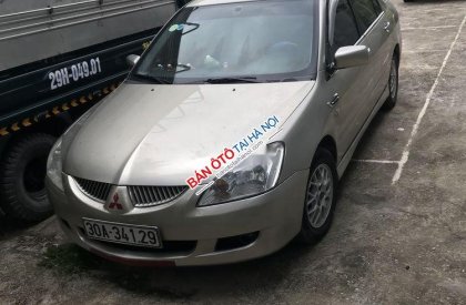 Mitsubishi Lancer 2004 - Chính chủ bán Mitsubishi Lancer đời 2004, màu vàng cát