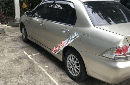 Mitsubishi Lancer 2004 - Chính chủ bán Mitsubishi Lancer đời 2004, màu vàng cát