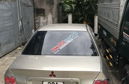 Mitsubishi Lancer 2004 - Chính chủ bán Mitsubishi Lancer đời 2004, màu vàng cát