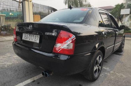 Mazda 323 2002 - Bán xe Mazda 323 năm 2002, màu đen, nhập khẩu nguyên chiếc chính chủ