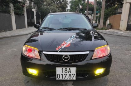 Mazda 323 2002 - Bán xe Mazda 323 năm 2002, màu đen, nhập khẩu nguyên chiếc chính chủ