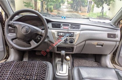 Mitsubishi Lancer 2003 - Cần bán Mitsubishi Lancer sản xuất năm 2003, màu vàng còn mới, giá 168tr