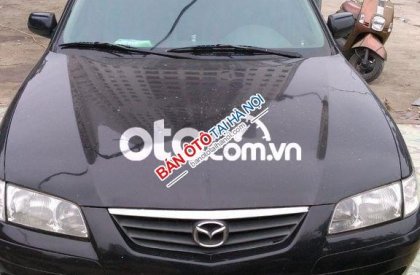 Mazda 626 MT 2001 - Cần bán lại xe Mazda 626 MT sản xuất năm 2001, màu đen