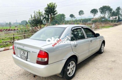 Mazda 323 2004 - Cần bán gấp Mazda 323 năm sản xuất 2004, màu bạc, xe nhập giá cạnh tranh