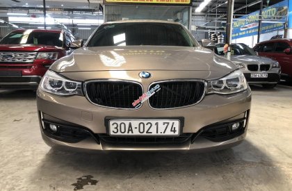 BMW 320i 2014 - Xe màu nâu, 690 triệu