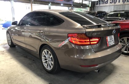 BMW 320i 2014 - Xe màu nâu, 690 triệu