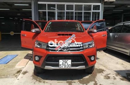 Toyota Hilux   3.0 AT 2015 Cam Đỏ đã lăn bánh 80.800 2015 - Toyota Hilux 3.0 AT 2015 Cam Đỏ đã lăn bánh 80.800