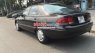 Mazda 626 MT 1995 - Cần bán lại xe Mazda 626 MT đời 1995, màu đen, số sàn