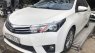 Toyota Corolla 2015 - Cần bán gấp Toyota Corolla sản xuất năm 2015, màu trắng số tự động, 570 triệu